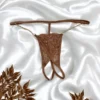 tanga renda taupe aberta correntes douradas laterais finas ajustáveis minimalista ousada sensual refinada delicada poliamida elastano