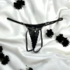 fio dental preto renda floral delicada sensual corrente dourada joia central alças ajustáveis costas abertas tamanho único